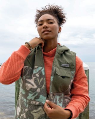 Women in fishing vest.