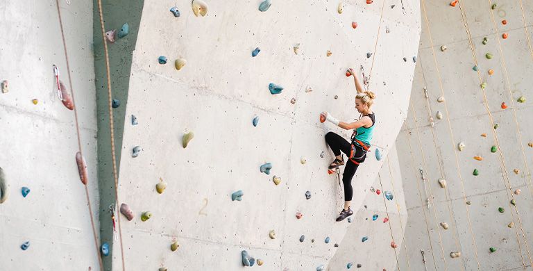Learn more about indoor rock climbing gyms, the community that surrounds these gyms, and how to get started rock climbing.