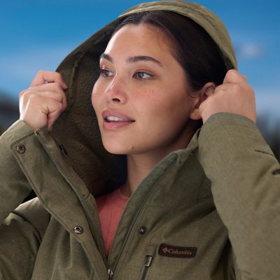 Close-up of a model putting up the hood.