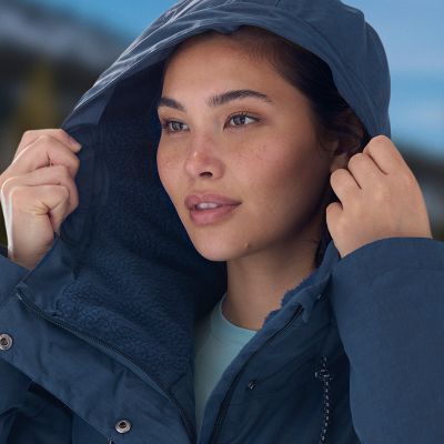 Close-up of a model putting up the protective hood.