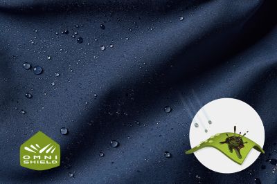 A close-up of droplets beading on fabric with the Omni-Shield logo in the bottom left while a graphic shows the rain-and-stain repellency in the bottom right.