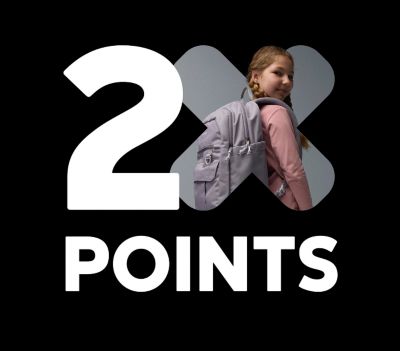 A girl wearing a backpack with text: 2X Points