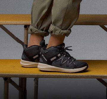 Close-up of a student's shoes as they stand on bleachers.
