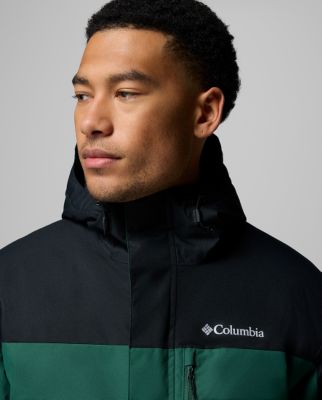 A man wearing a multi-color jacket