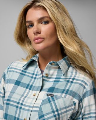 A woman wearing a flannel