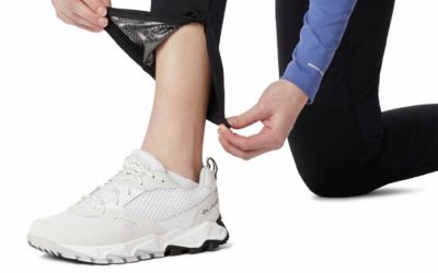 The zip of the side pocket of a pair of hiking trousers