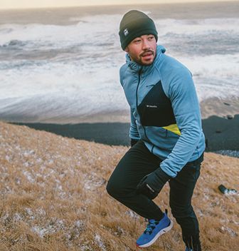 A man hiking on a hill.
