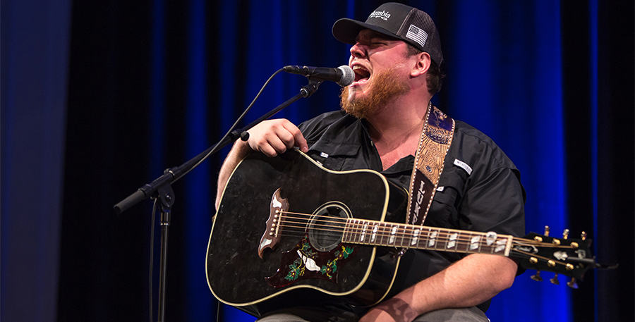 Luke Combs performs on stage.