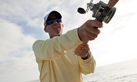 A fisherman wearing an Omni-Freeze shirt. 