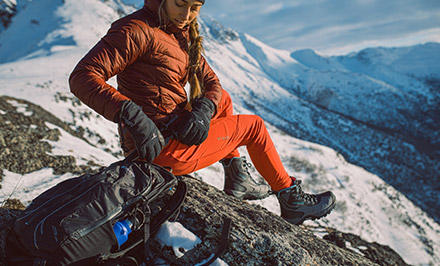 A mountain climber wearing boots with Omni-Heat. 