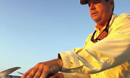 A fisherman wearing gear with Omni-Shield Blood n Guts technology. 