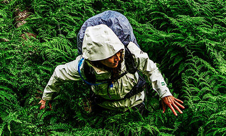 A woman wearing an OutDry Extreme Eco jacket. 