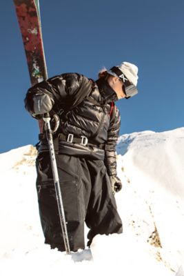Manon holding her skis wearing the Women’s Phantom™ Alpine Down Jacket.

