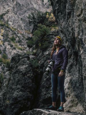 Nikki looking around at her surroundings as she holds her camera