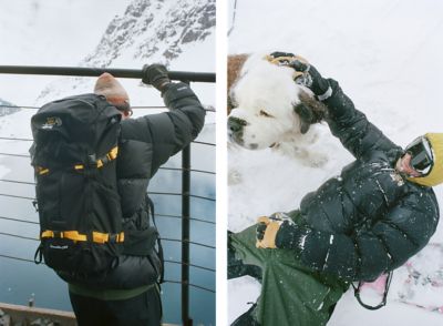 A snowboarder wearing the Stüssy x Mountain Hardwear collab in the snow