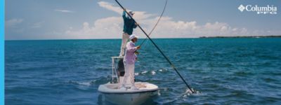 Two people fishing from a boat