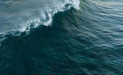 beautiful turquoise wave crashes in the ocean