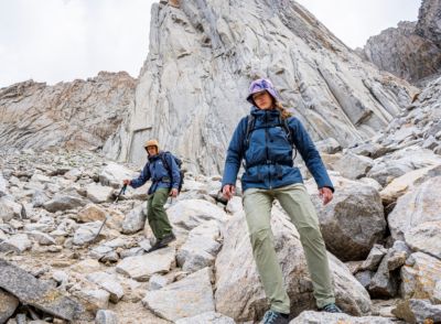 Two climbers make their approach in the high alpine.
