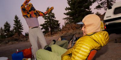 Two campers chilling at camp.