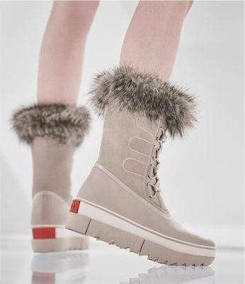 Close up of Joan NEXT boots with futuristic background