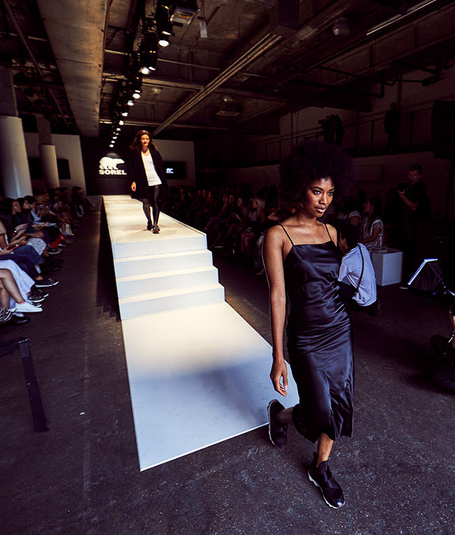 Women walking down the stairs of inside the SOREL Mile-Long Runway event