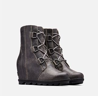  A pair of Joan Wedge  boots on a white background