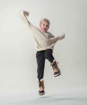Image of child with SOREL boots on