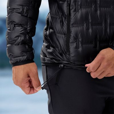 Model slipping their phone into the zipping hand pocket.