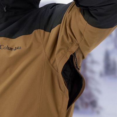 Model lifting up their arm to reveal the zippered, breathable underarm vents.