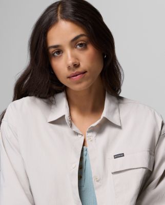 A woman wearing a button-up shirt