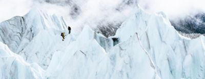 Image of Garrett Madison and Tim Emmett product testing future Absolute Zero Suits in the glacier fall near Everest Base Camp.