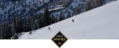 GORE-TEX logo overlayed on a couple skiing in the backcountry; big landscape, little people image.