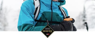 GORE-TEX logo overlayed on a close-up image of the Men's High Exposure™ Gore-Tex® C-Knit™ Jacket